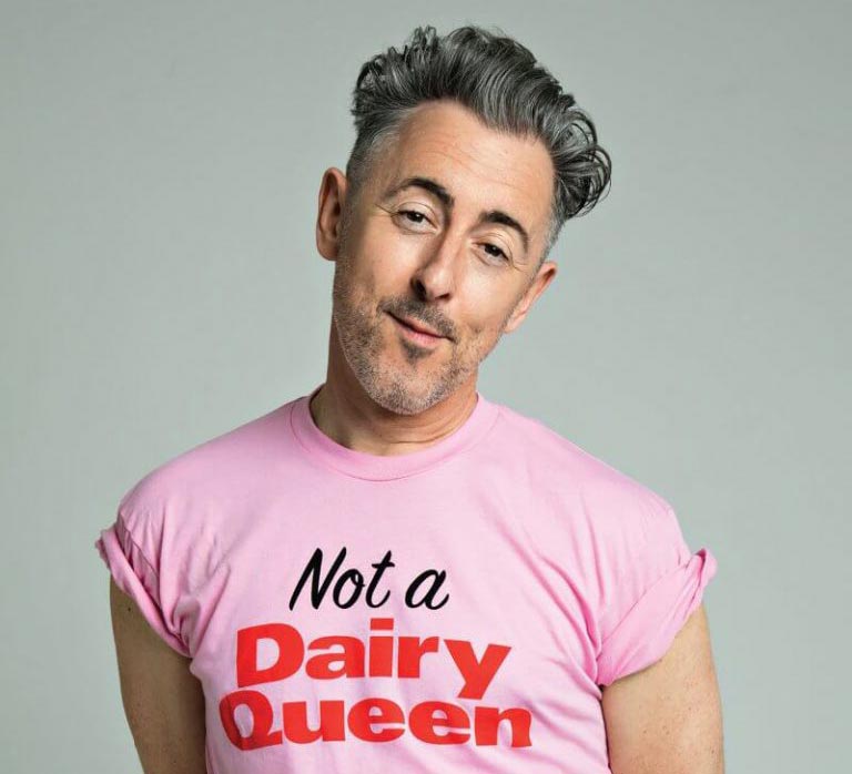 Alan Cummings wearing a 'Not a dairy queen' t-shirt 