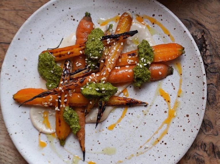 Oak's menu is a celebration of locally-grown vegetables with small dishes like baby carrots with zhoug and tahini to pick and choose from. Photo © Oak Restaurant