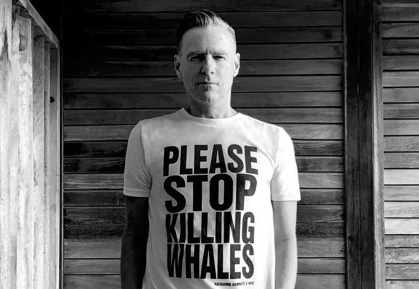 Bryan Adams wearing a T-Shirt that says "Please stop killing whales"