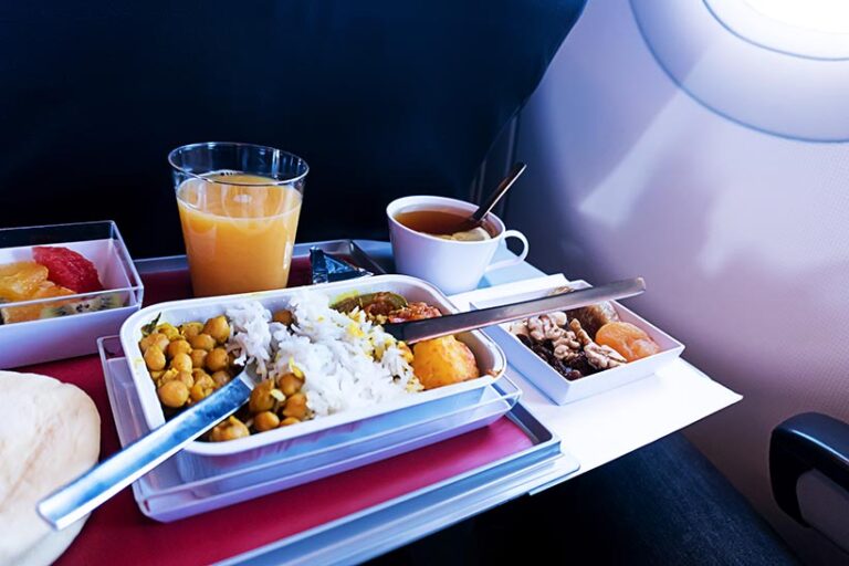 Many airlines offer vegan meals if you book in advance, just make sure to pack some snacks just in case you get hungry. Photo © Diy13 via Getty Images