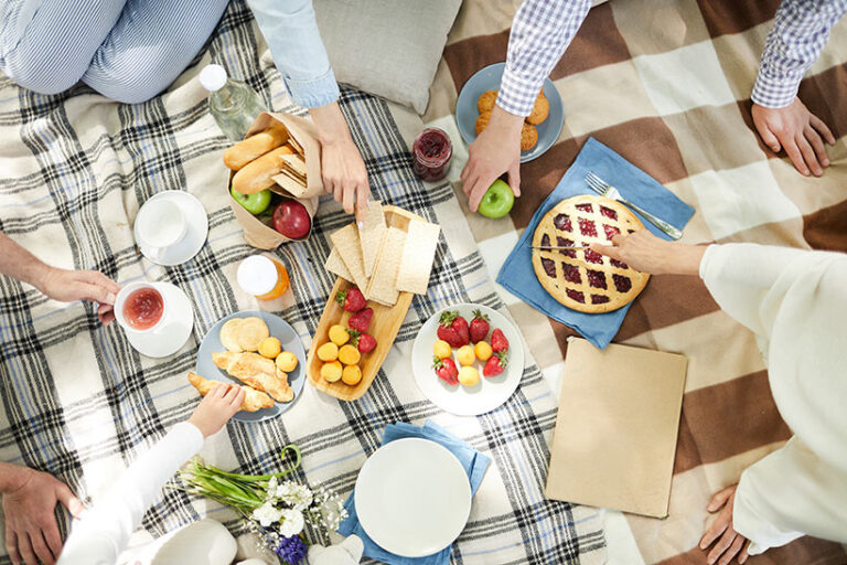 Everybody enjoys a sweet treat on a picnic. Be sure to take plenty of fruits and baked goods. Photo © pressmaster via Adobe Stock