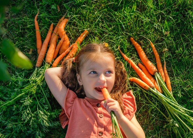 Get children started early enjoying the benefits of carrots - they make the ideal healthy snack! Photo © Maryna Auramchuk via Getty Images