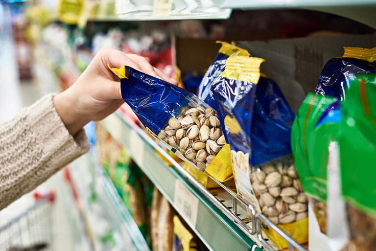 Flavoured nuts and other snacks can contain milk, honey, or even gelatine. Read the labels or opt for unflavoured vegan snacks to be safe. Photo © sergeyryzhov via Getty Images