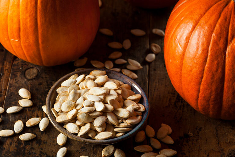 Pumpkin seeds are a healthy snack, so reserve them when you carve your Halloween Jack o' Lantern. Photo © bhofack2 via Getty Images