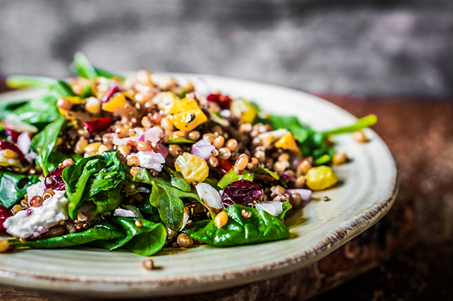 Healthy salad with spinach,quinoa and roasted vegetables