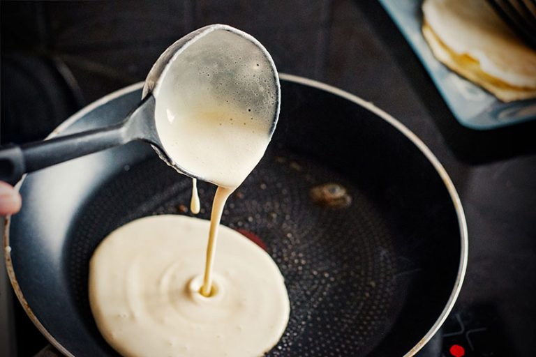 To make pancake without eggs and dairy, you need flour, plant-based milk such as oat or soy, and a binding ingredient like flaxseed, chia, banana and even applesauce. Photo © exousia via Getty Images