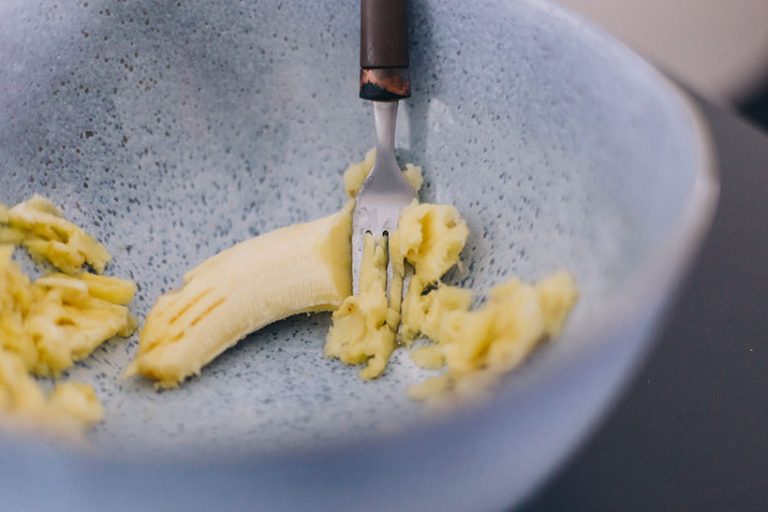 Mashed banana makes a great vegan egg substitute in sweet vegan baking recipes. Photo © Carolin Voelker via Getty Images