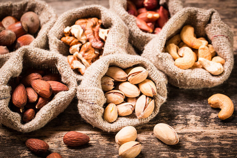 Nuts, like almonds, pistachio and walnuts, are a great source of vitamin B7. Photo © id-art via Getty Images