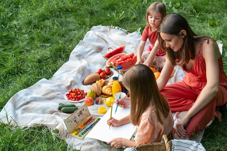 Notepads, a frisbee, or a board game are simple additions to make your picnic fun. Photo © Вадим Каштанов via Adobe Stock