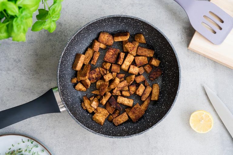 Tempeh’s dense texture makes it perfectly suited to sautéing, grilling, baking in the oven, pan frying or air frying. Image credit: OKrasyuk via Getty Images