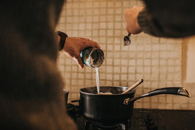 Canned coconut is rich and thick and perfect for using as a creamy base in recipes. Image credit: Catherine Falls Commercial via Getty Images