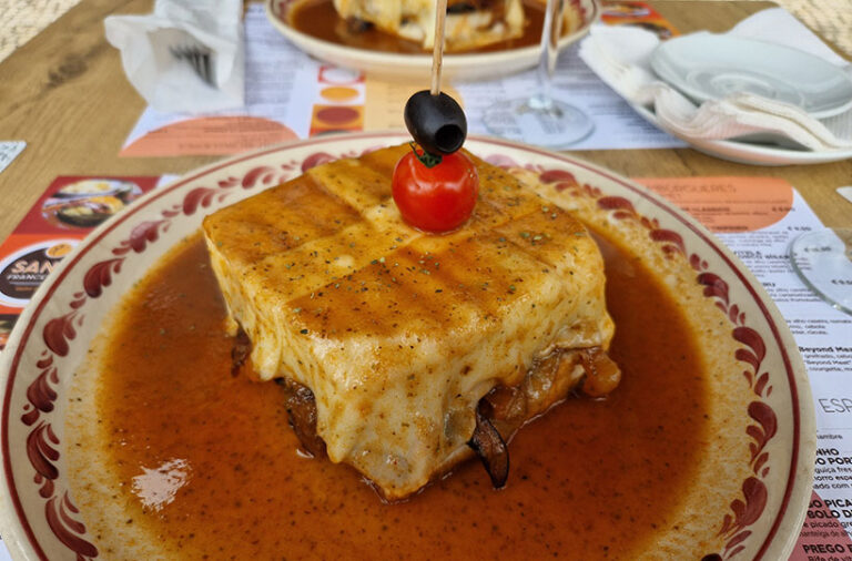 Santa Francesinha's vegan francesinha was filled with delicious layers of seitan steak, mushrooms, veggies and melted vegan cheese. Photo © Selene Nelson