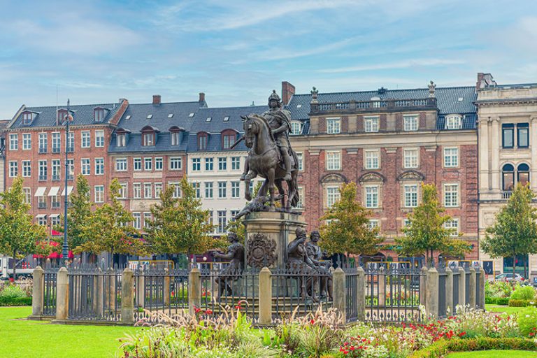 The equestrian statue of Christian V on Kings New Square Kongens Nytorv in Copenhagen, Denmark. Image credit: Viacheslav Chernobrovin via Getty Images