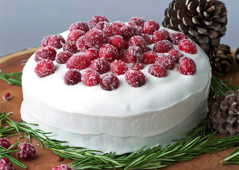 Vegan christmas cake with meringue and sugared cranberries