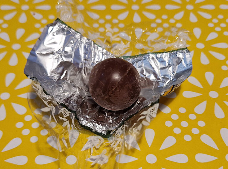 Despite an afternoon in the desert heat, the shiny, dark chocolate shell of the Lindt vegan truffles is still apparent. Photo © Vegan Food & Living