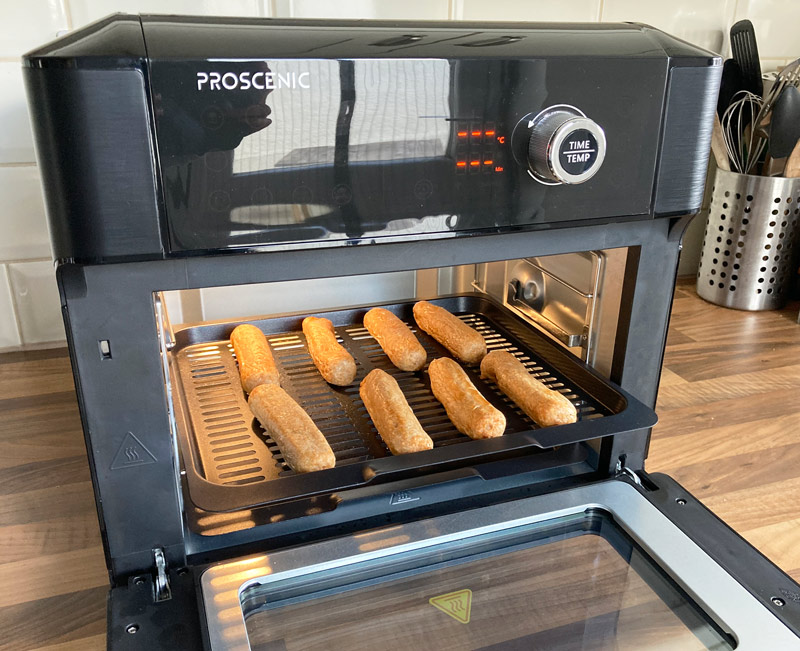 Vegan-sausages-cooking-on-a-tray-in-the-Proscenic-T31-air-fryer-oven