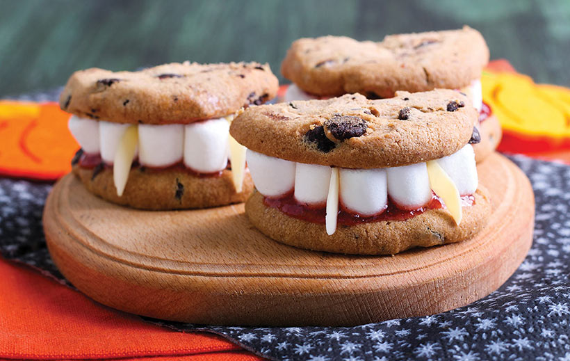 Cookie sandwiches with mini marshmallow 'teeth', almond 'fangs' and strawberry jam 'blood' - vegan Halloween recipes