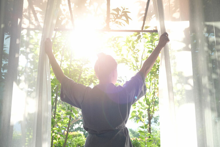 Open your windows to allow fresh air to flow into your home and remove condensation. Photo © Photo Sesaon via Adobe Stock