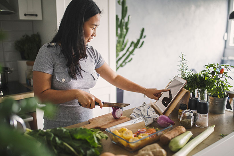 woman making healthy vegan meal plan